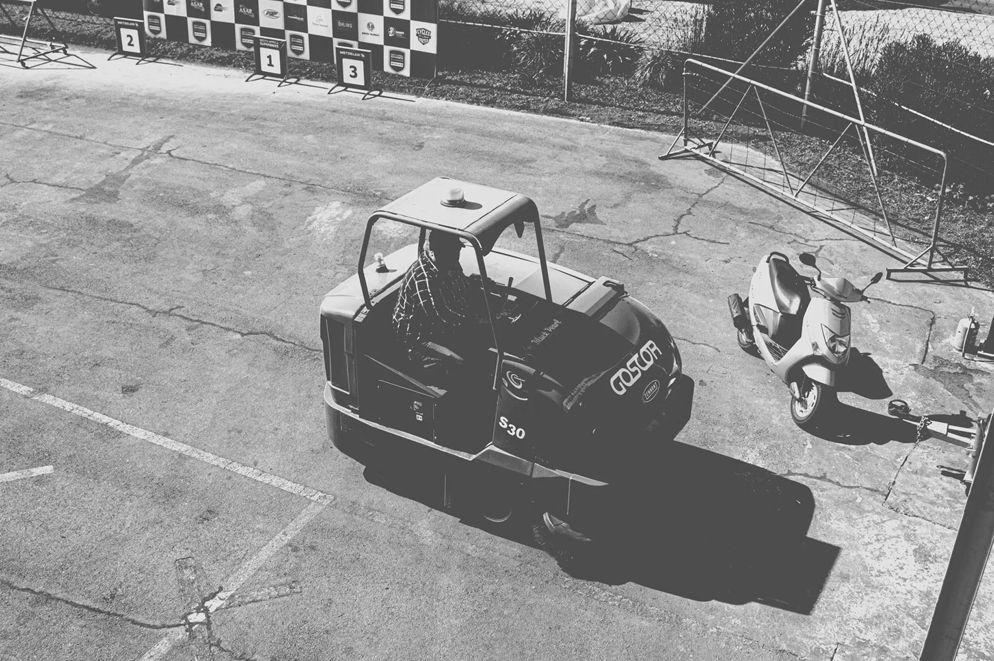 2019-07-27 - Zwartkops Raceway - Track clearing machine beside scooter