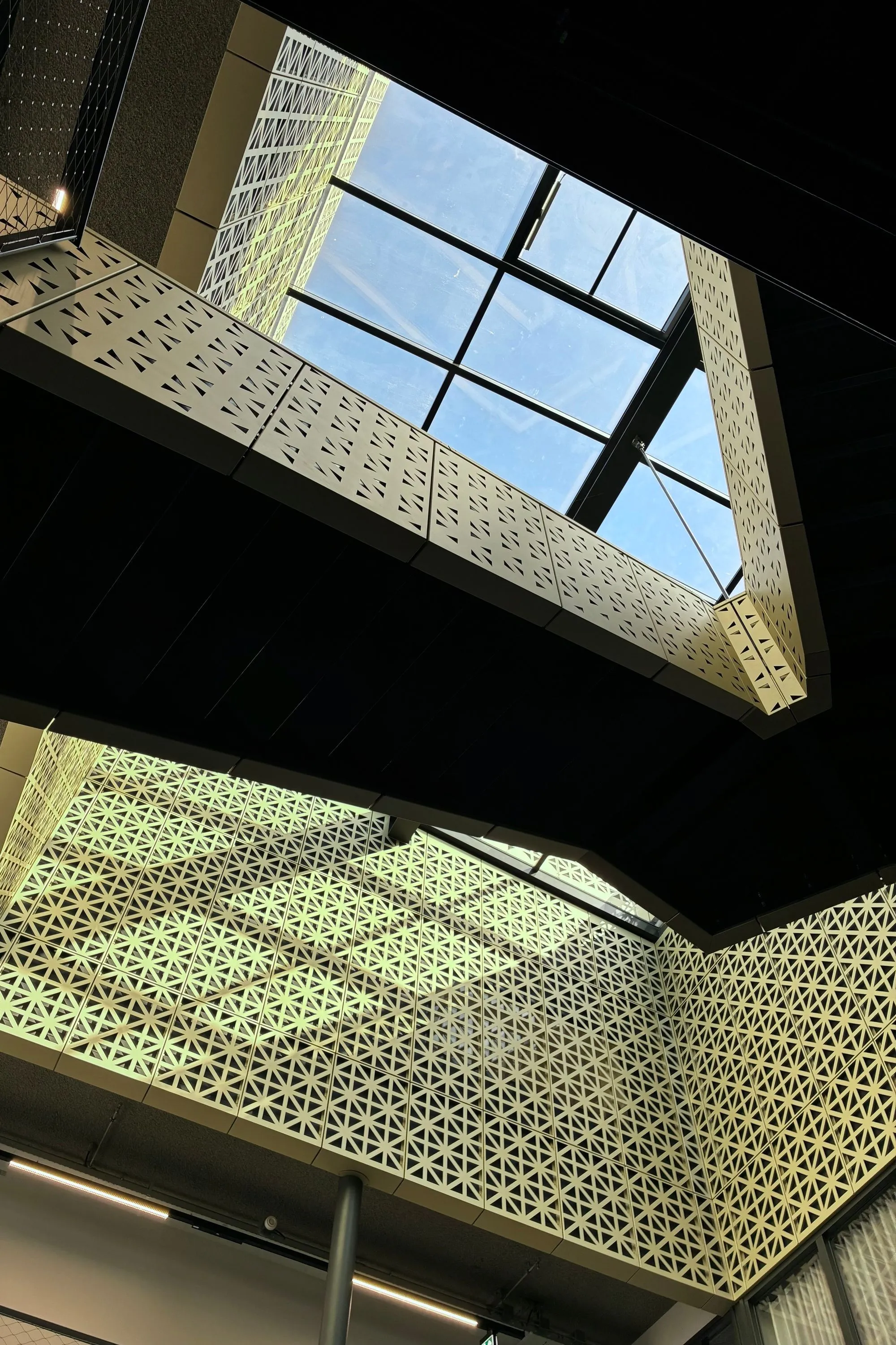 2026-03-28 - Sunlight on side of building interior with staircases criss-crossing