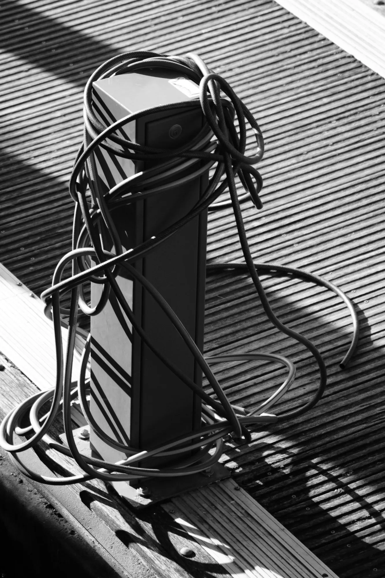 2026-08-02 - Pipes tied around post on dock