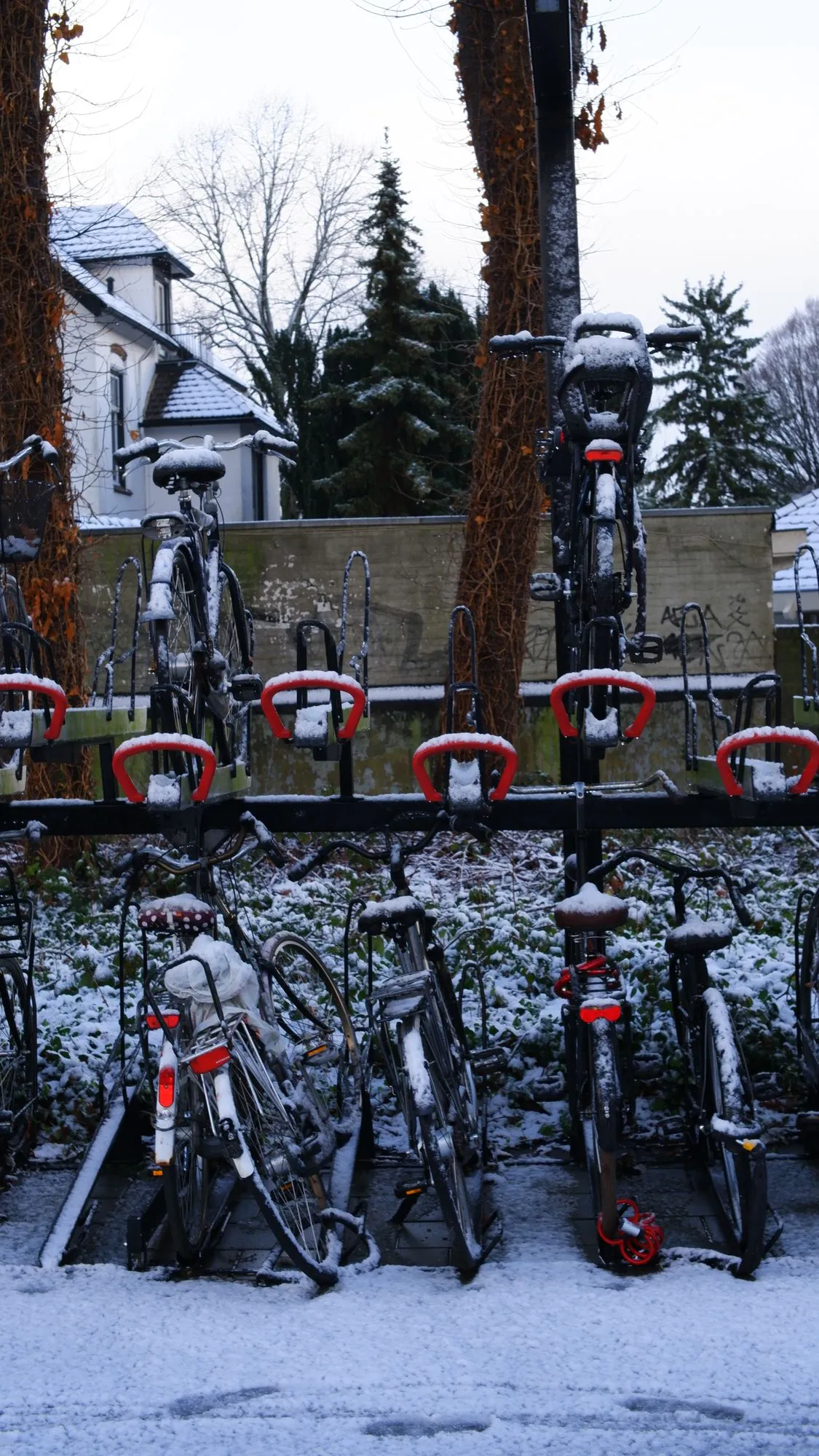 Bicycles parked in snow at train station
