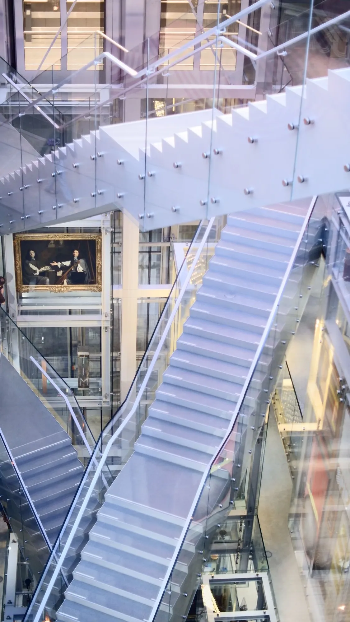 Criss-crossing staircases inside of art gallery
