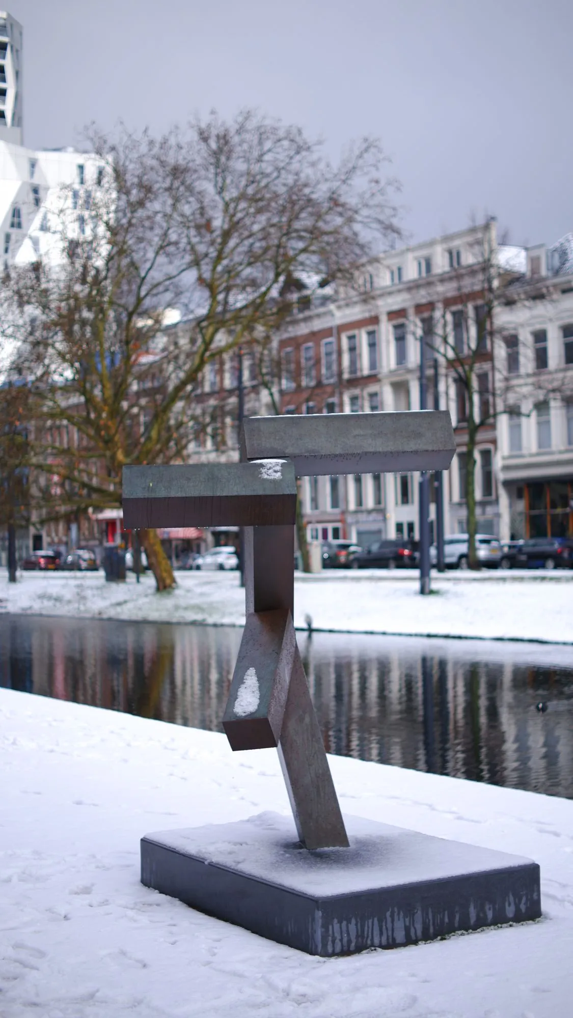 Sculpture beside canal in the snow