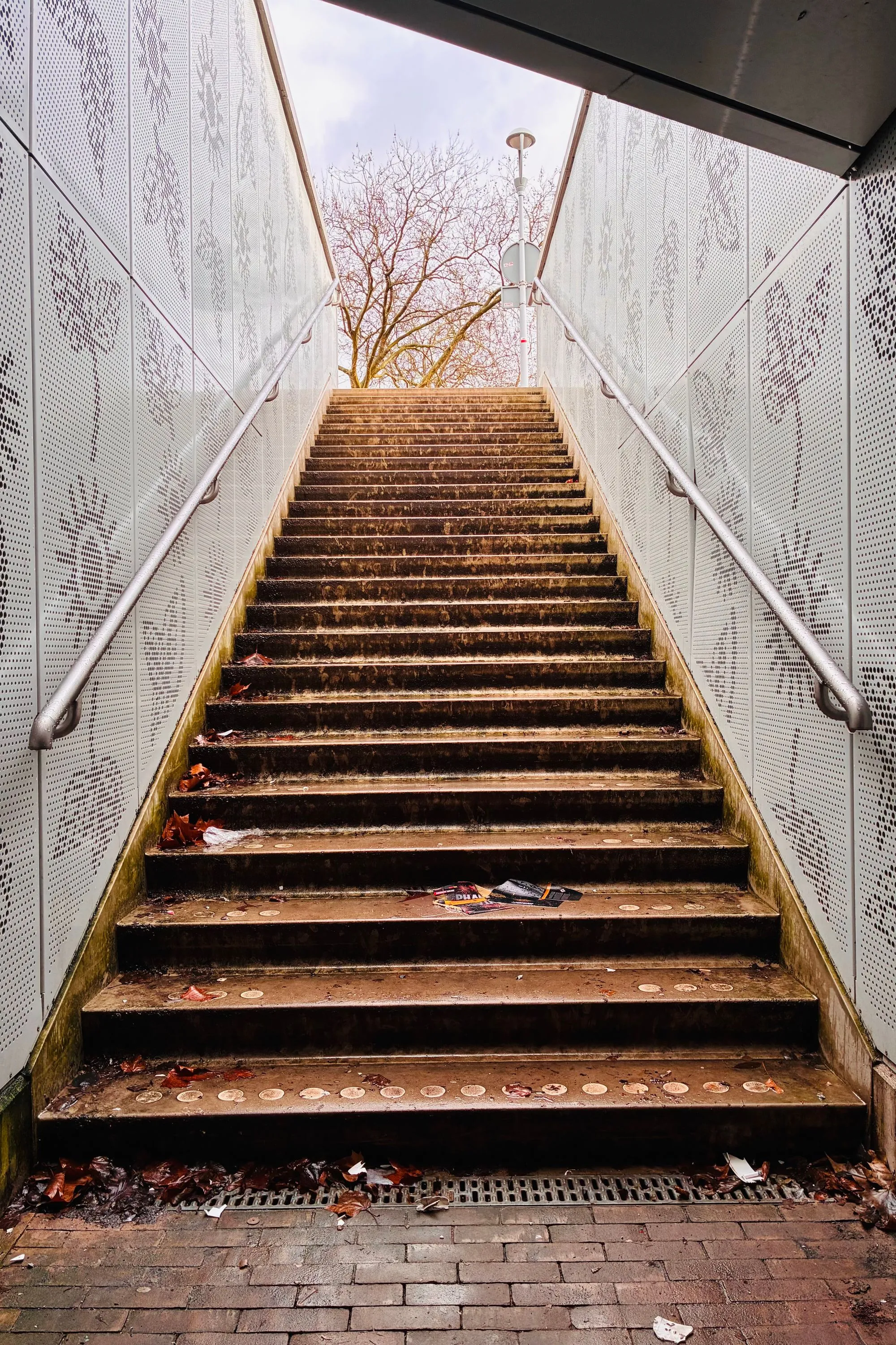 Staircase leading up towards warm light