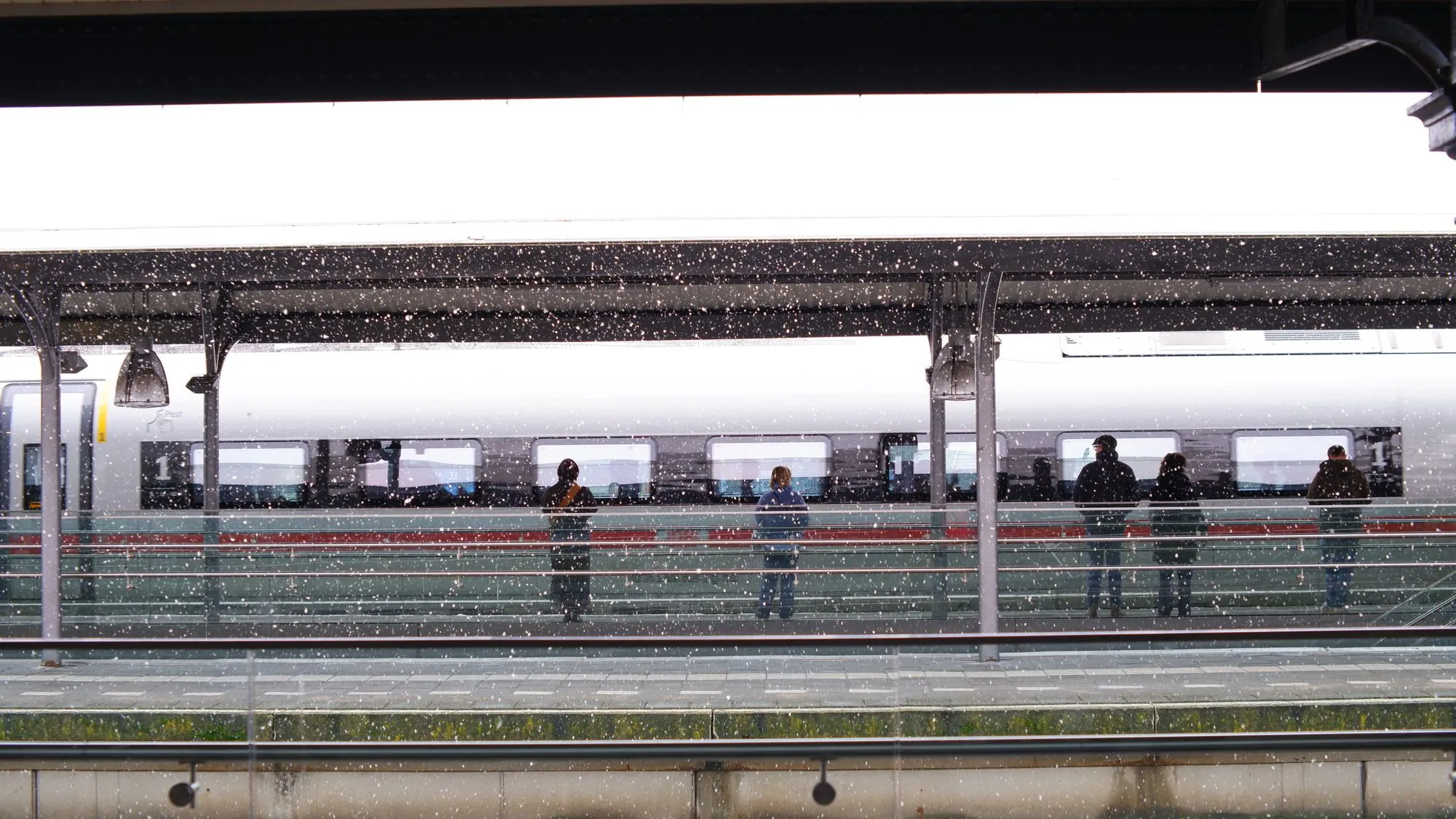 Train station with falling snow