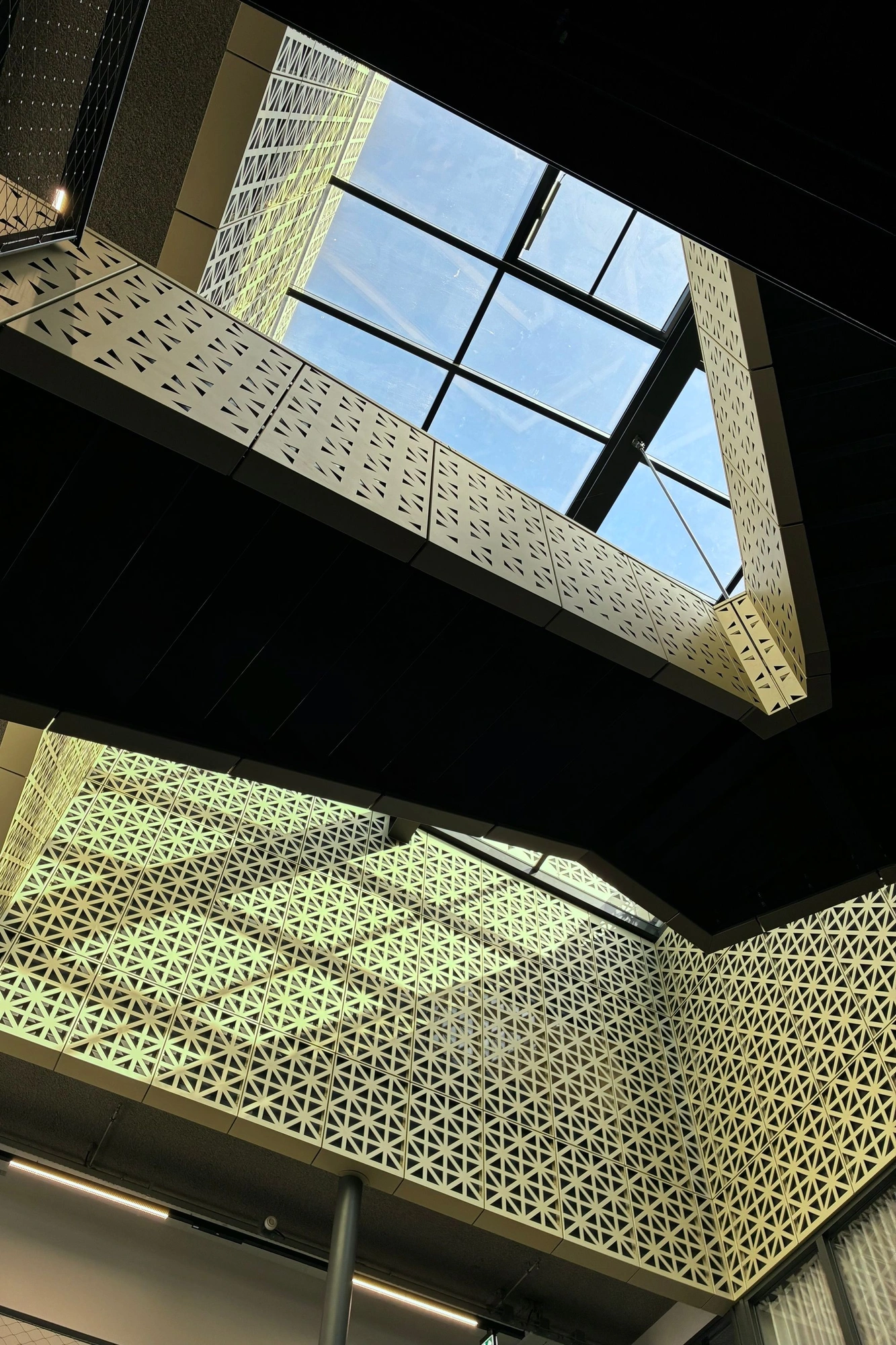 2026-03-28 - i16 - color - NL - Rotterdam - Sunlight on side of building interior with staircases criss-crossing