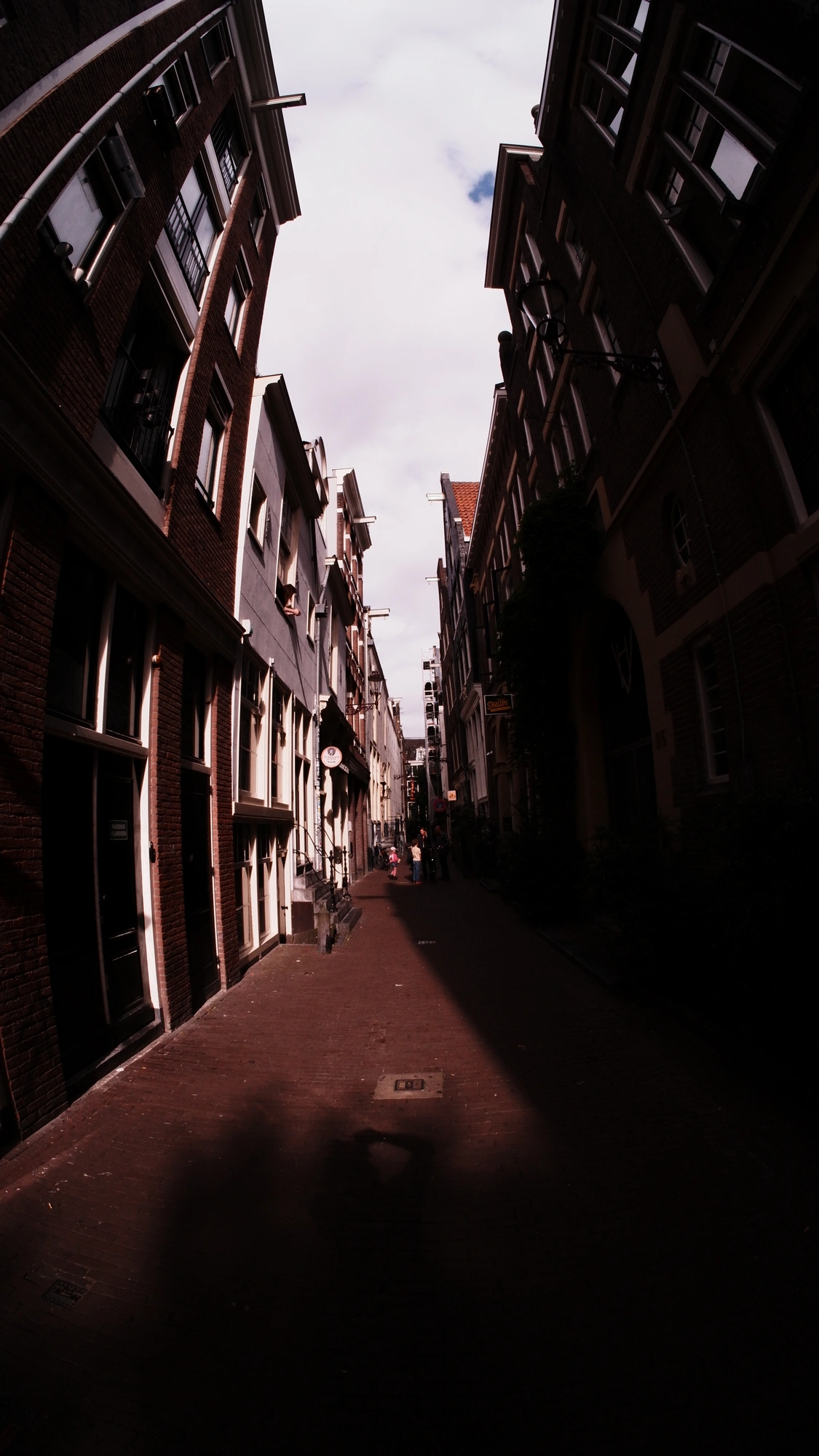 Alleyway lined by old dutch buildings