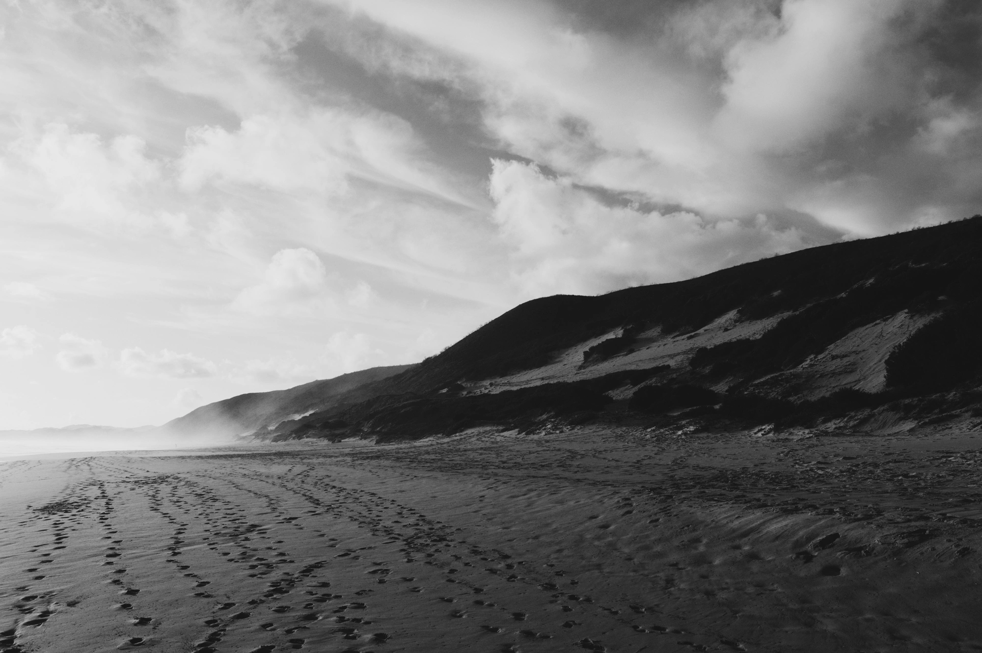 Sand, Mountain, and Clouds