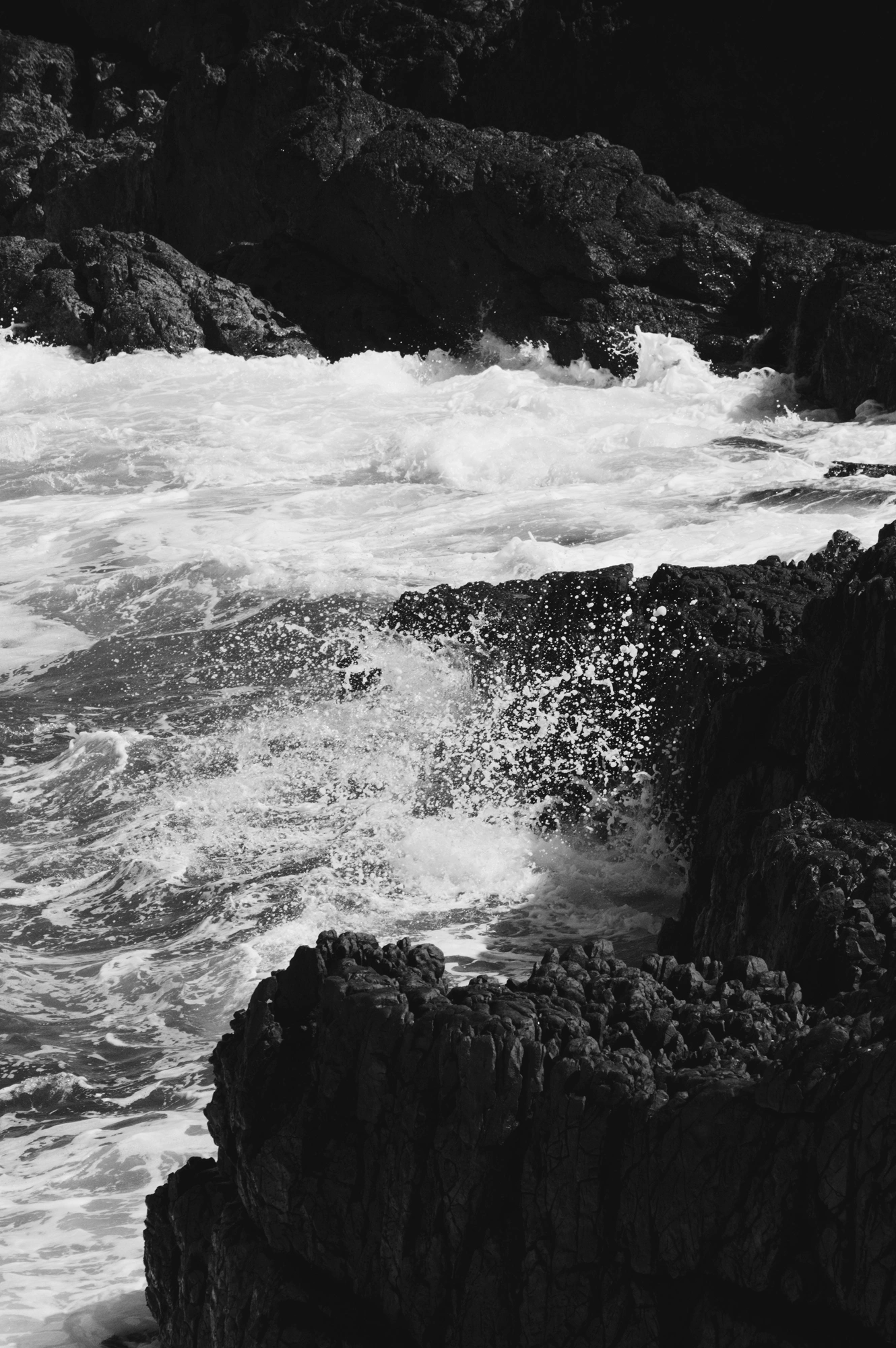 Waves splashing into rocks