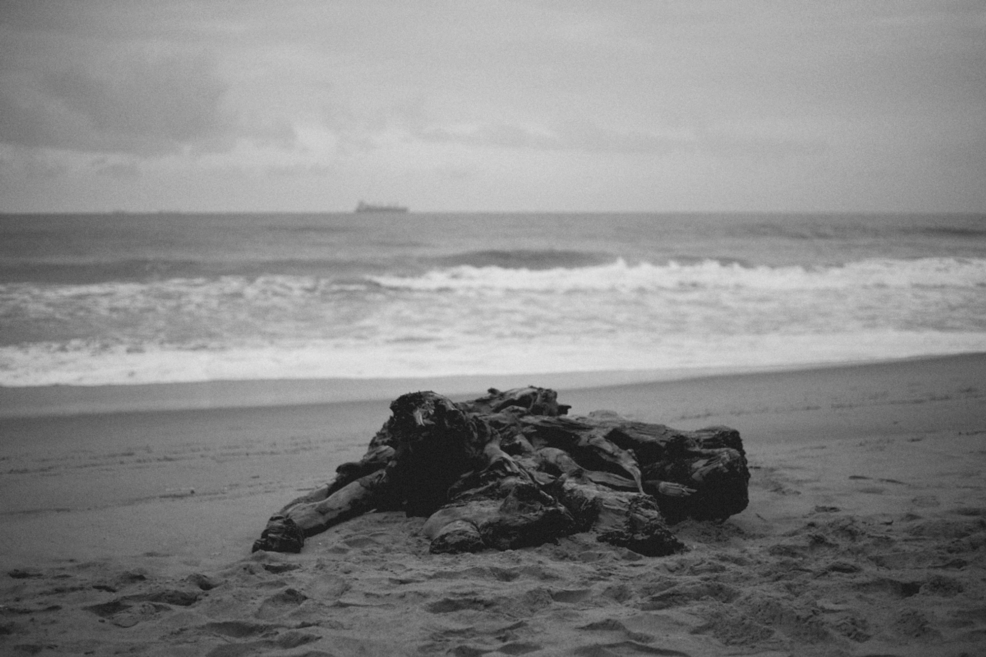 2022-09-18 - xt35 - bw - ZA - Durban - Pile of rocks on beach