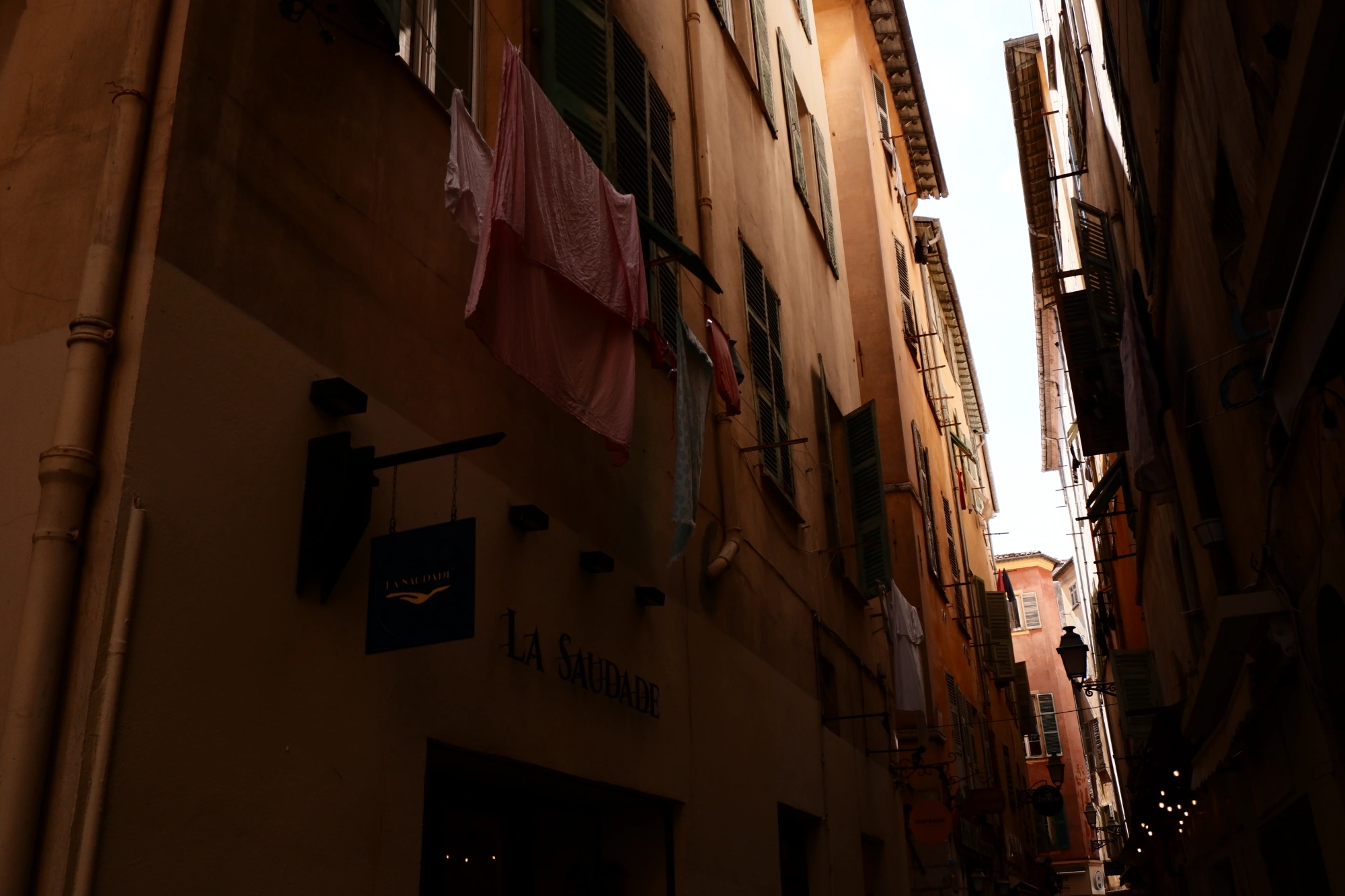 Launry on balconies in alley