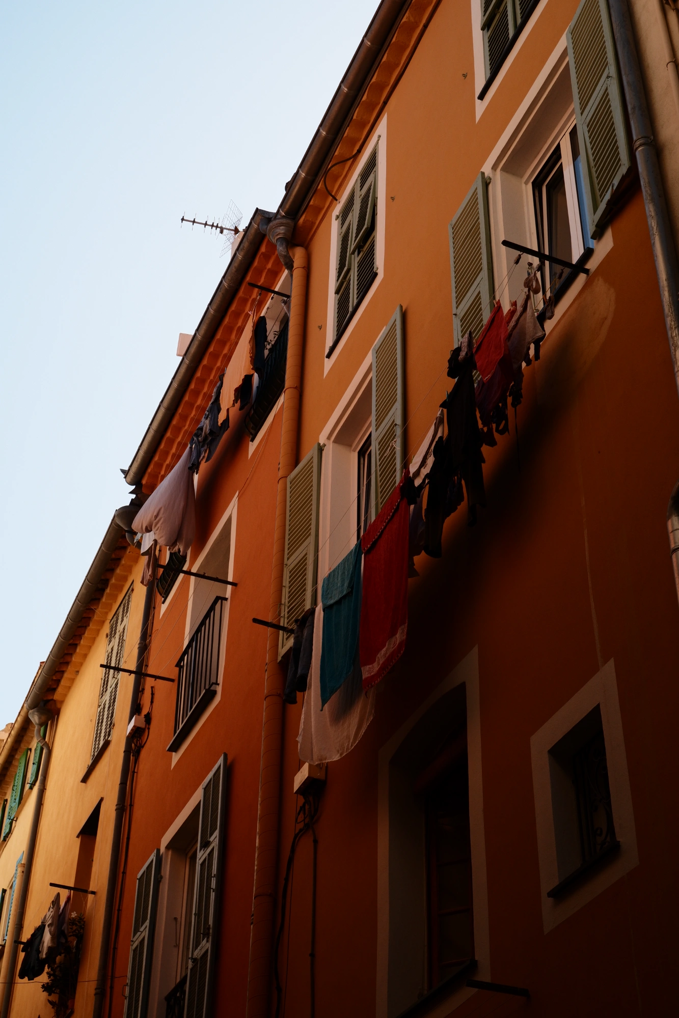 Many lines of washing along building side