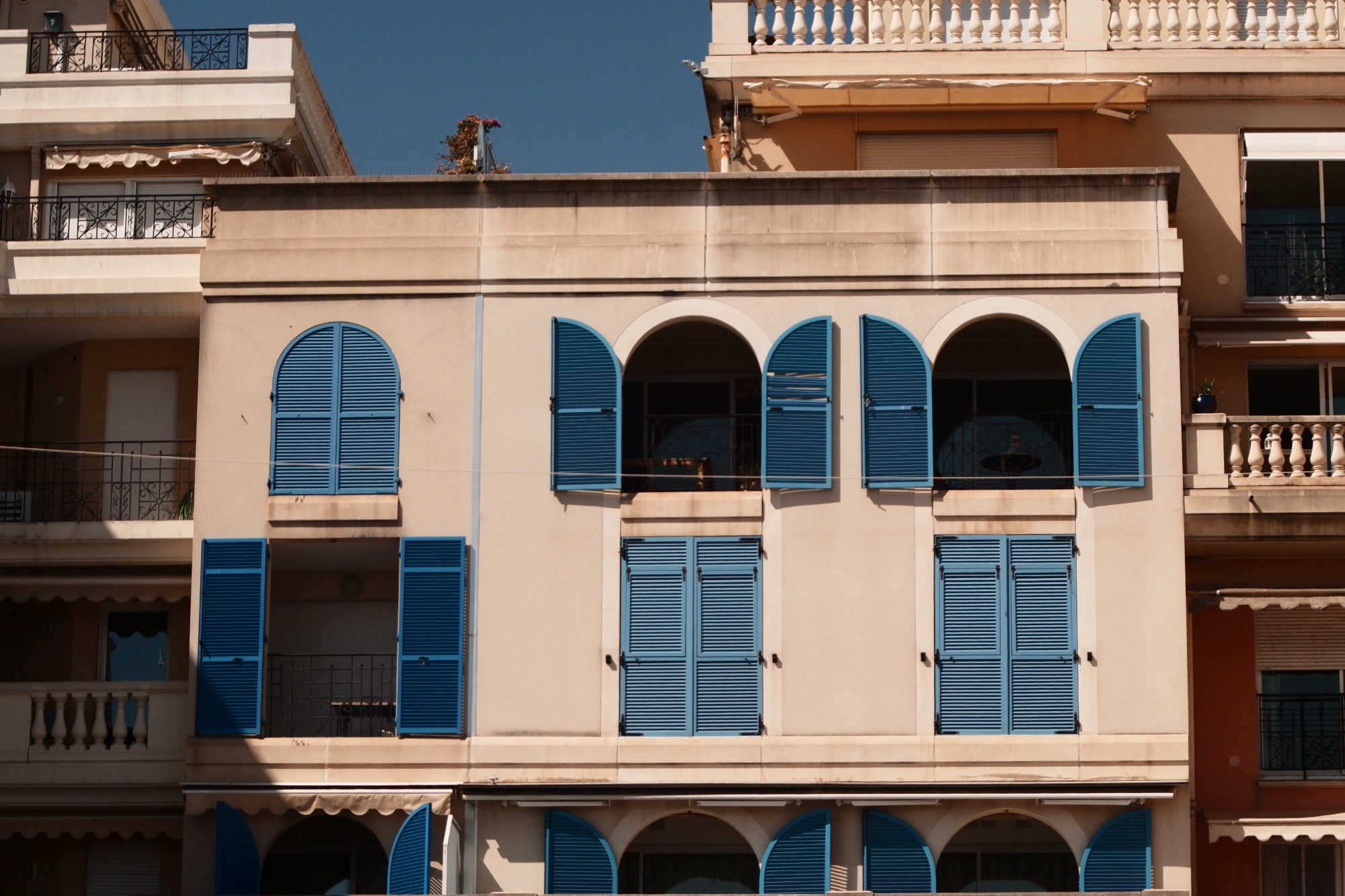 Blue window blings on orange building