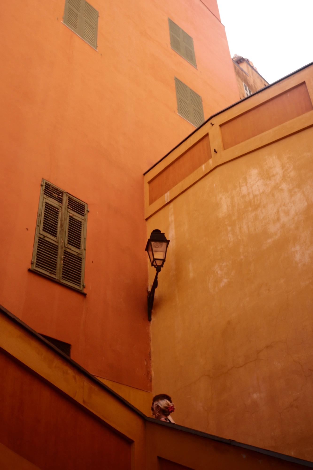 Corner of orange walls along staircase