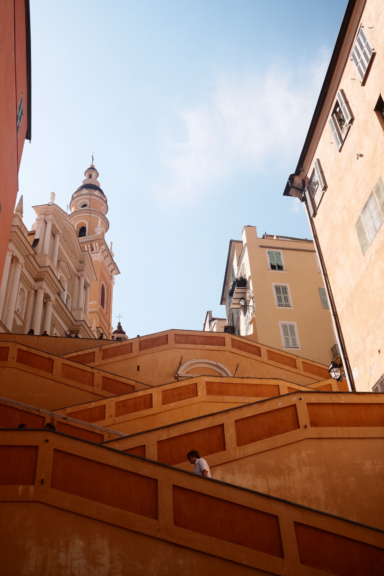 Staricases leading up to buildings in background