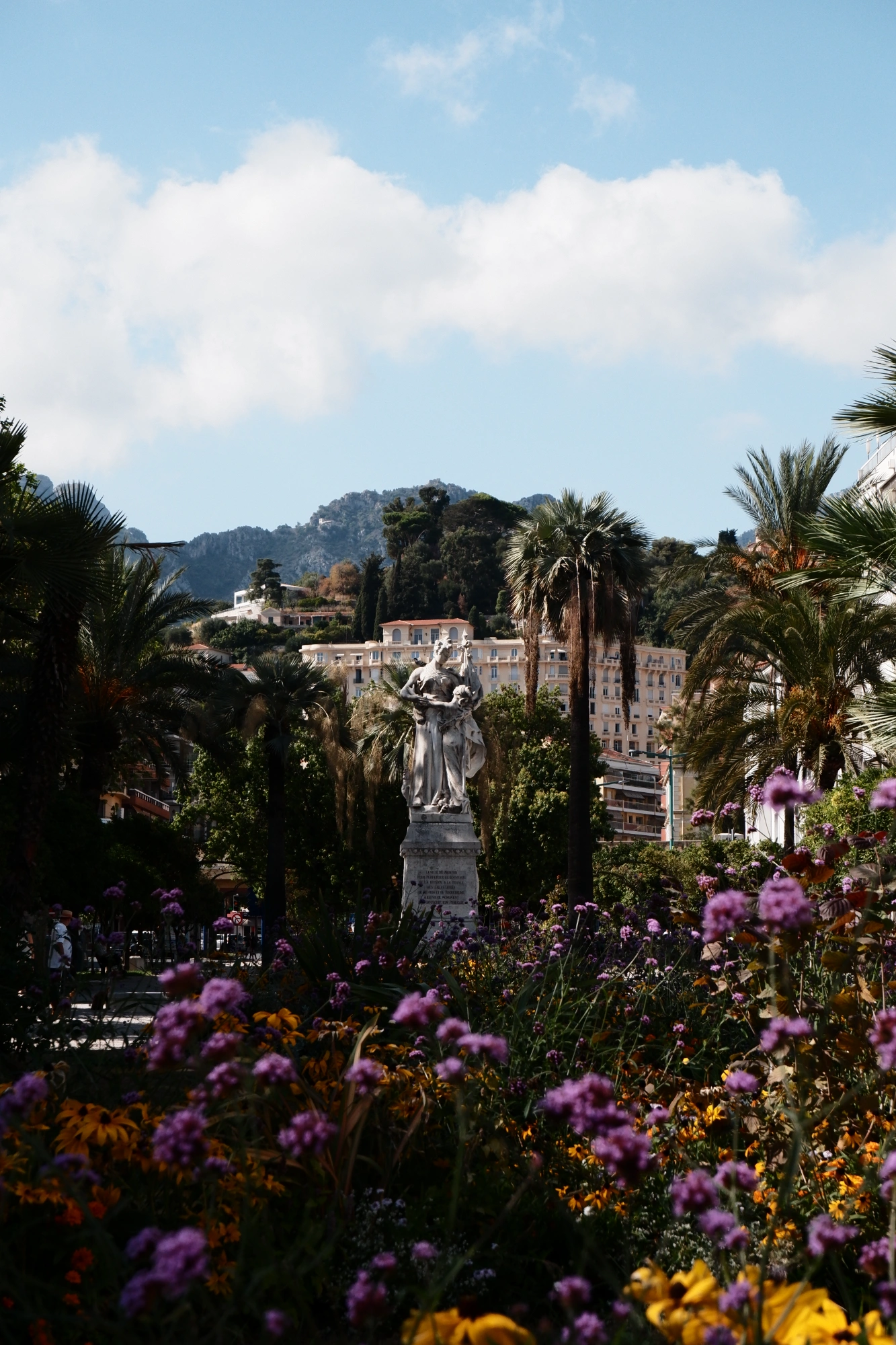 Statue with flowers in the foreground