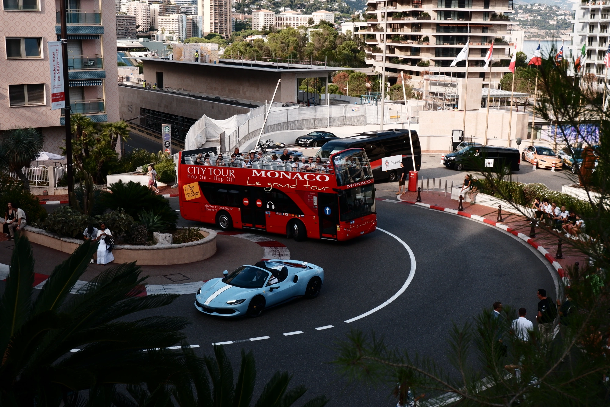 Cars driving up hairpin bend