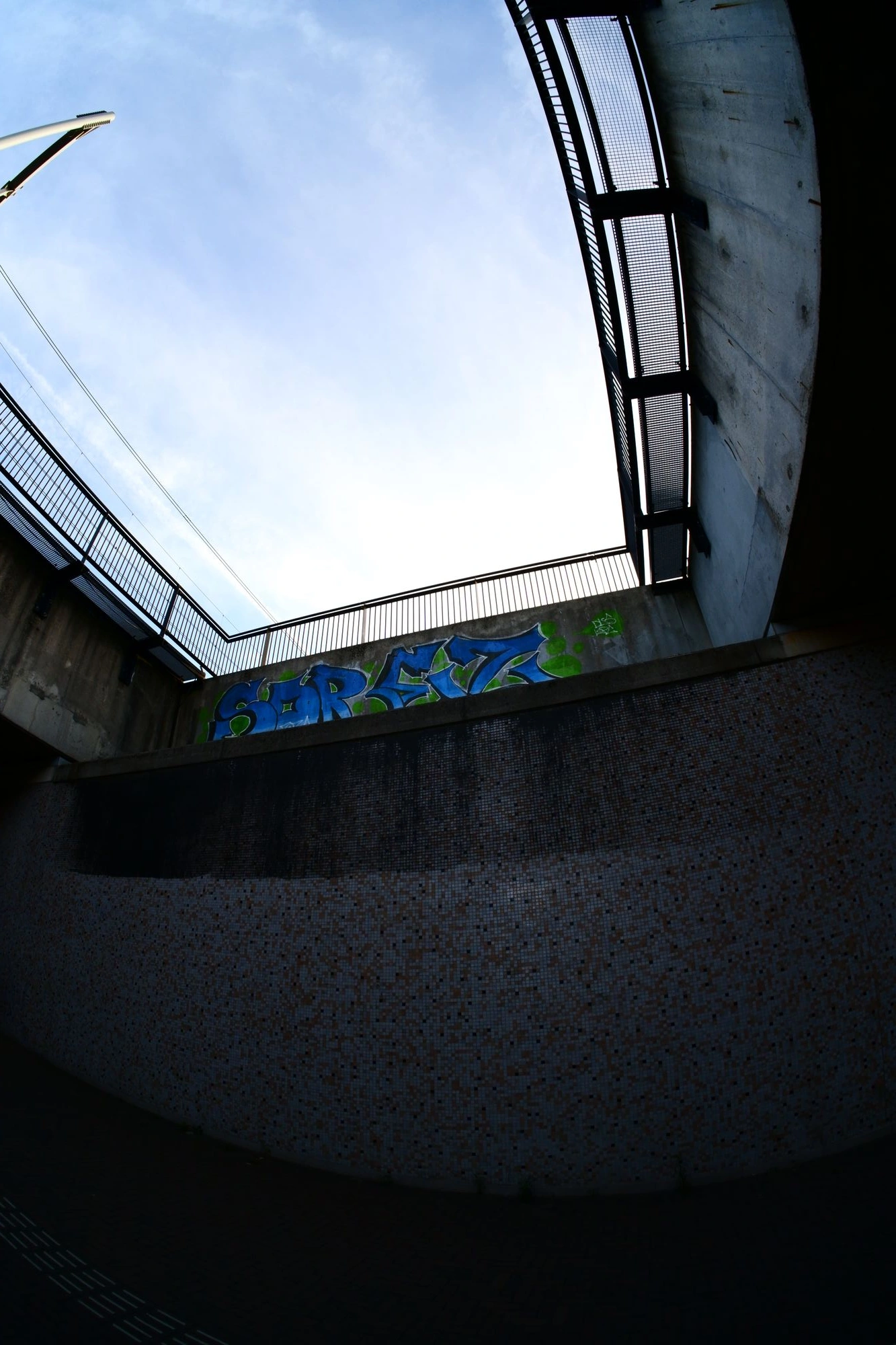 Grafitti between two overhead bridges
