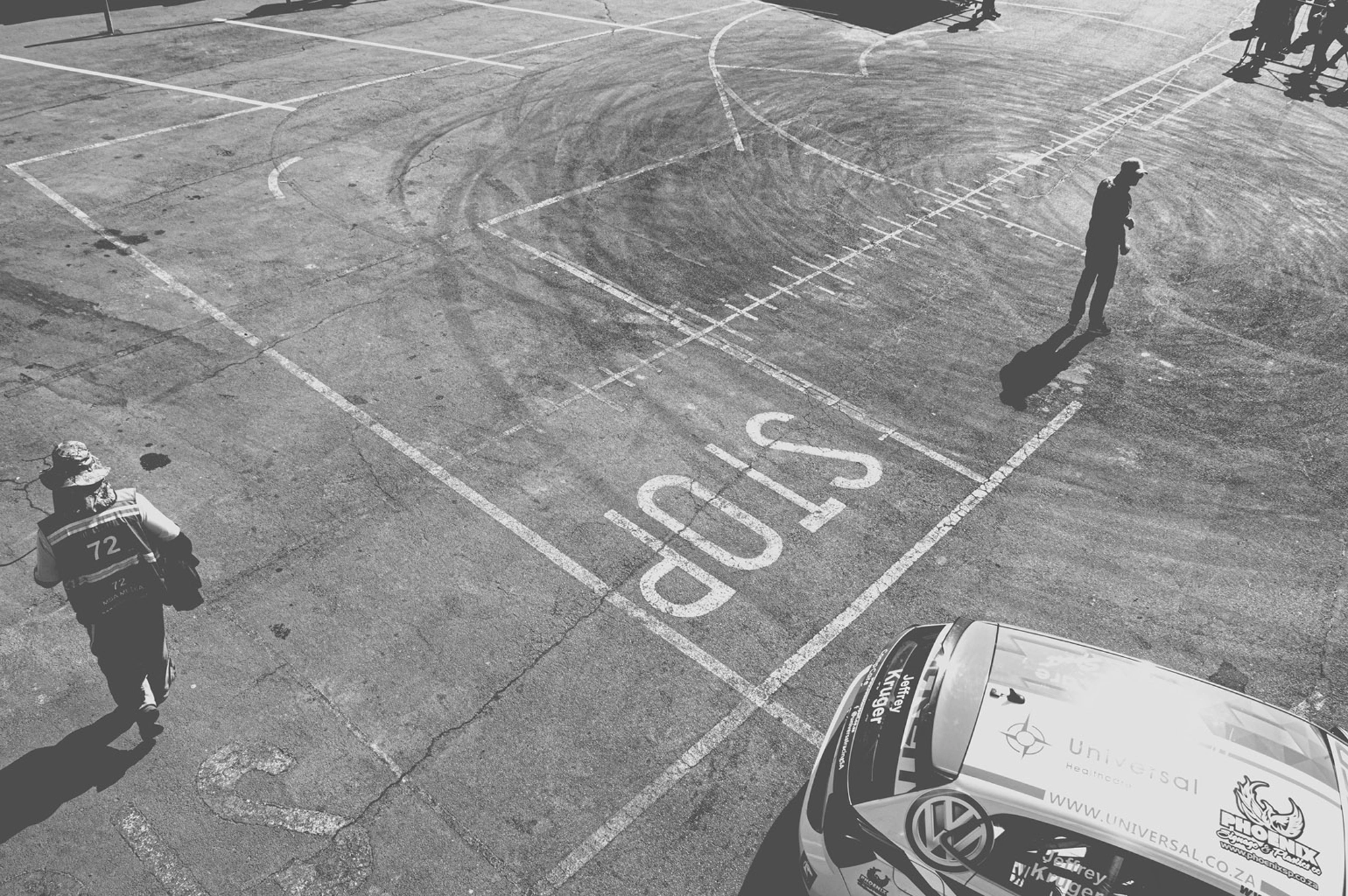 2019-07-27 - n18-55 - bw - ZA - Zwartkops Raceway - Man surrounded by tire skidmarks