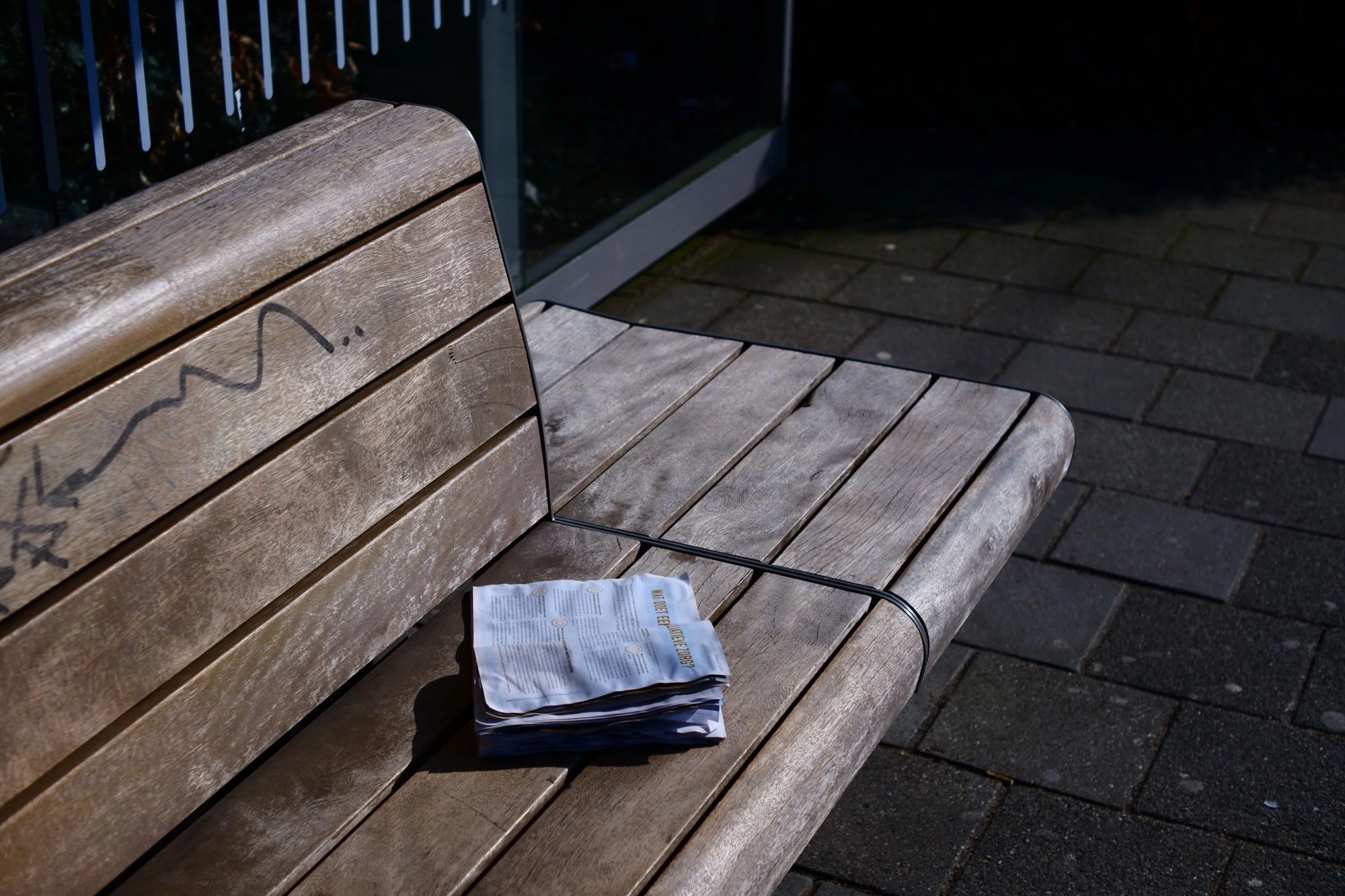 2026-03-15 - Book on bench in the sun.J
