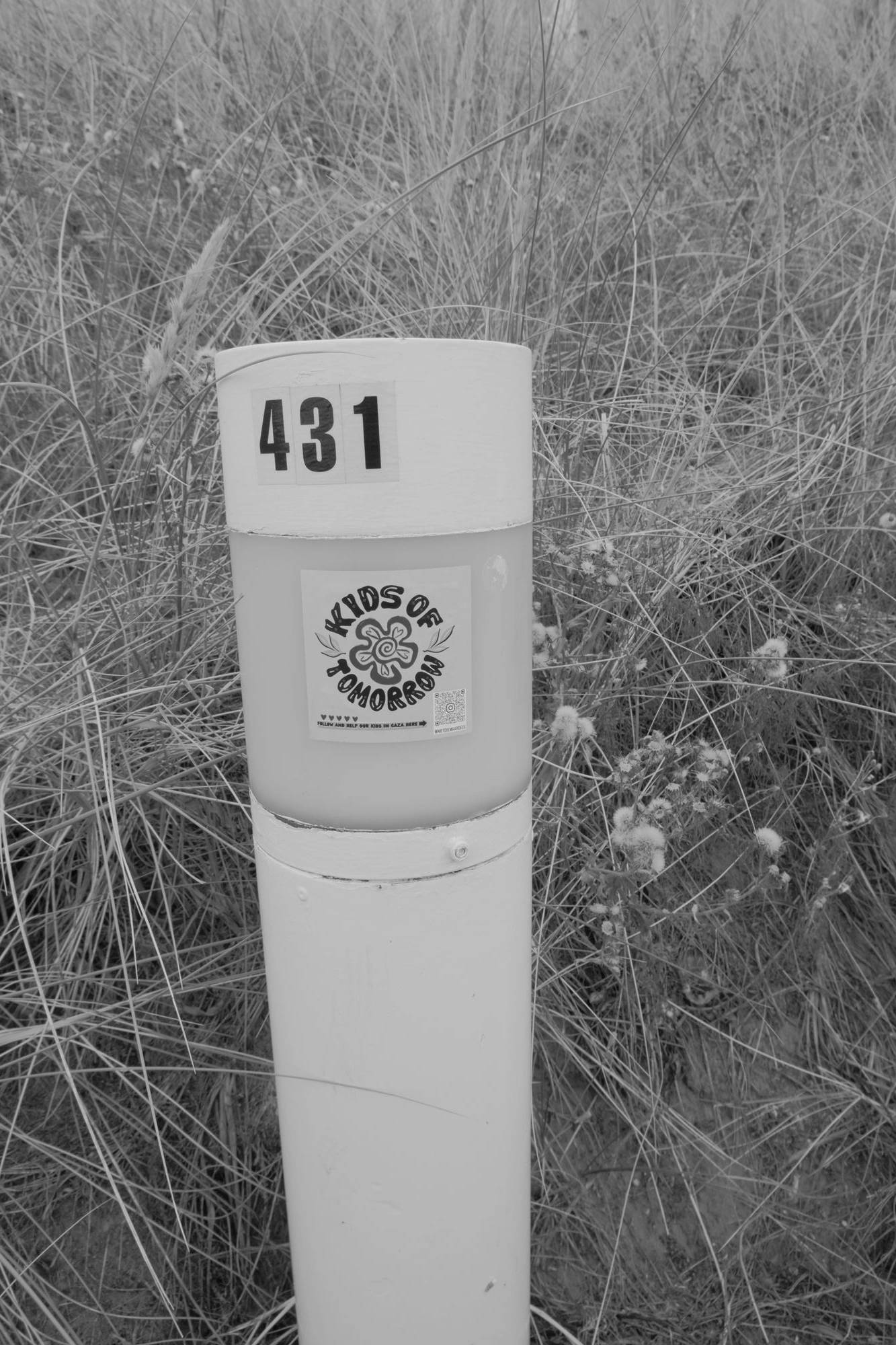 2026-07-18 - Scheveningen - Sticker on post that says Kids of Tomorrow.J