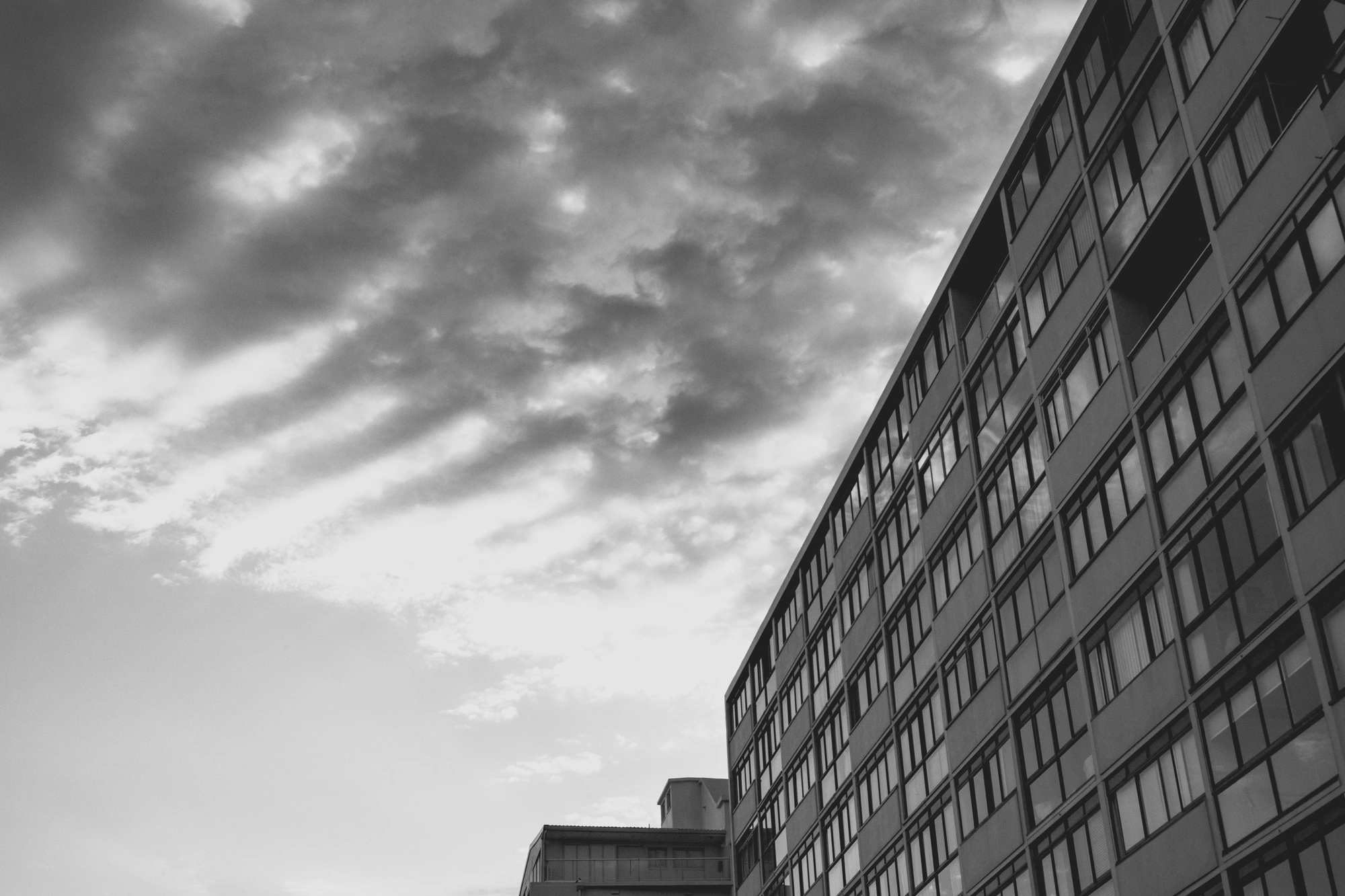 2022-02-13 - Cape Town - Clouds and a building with reflectins in the window.j