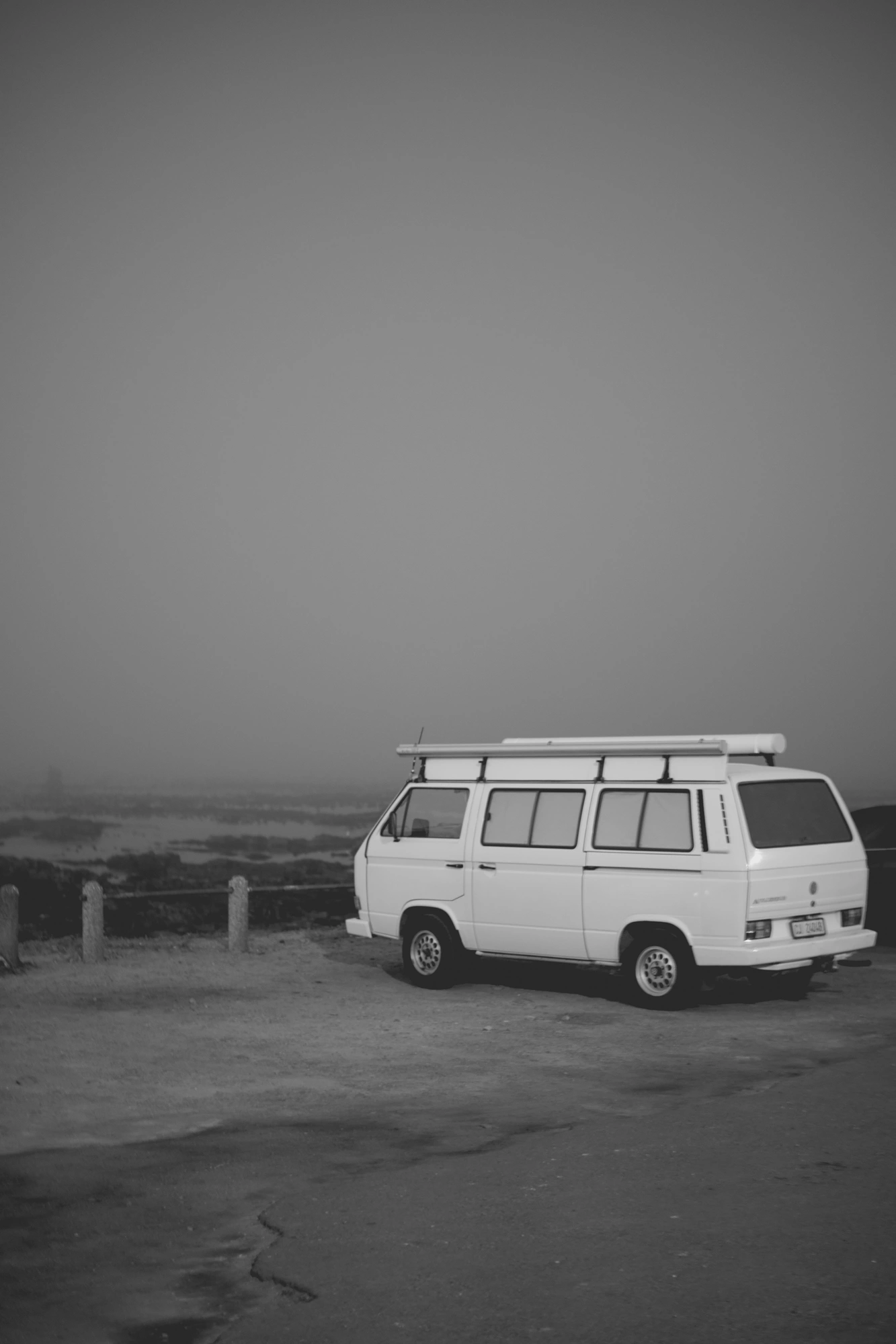 2022-02-15 - Cape Town - Van parked beside beach on misty day.j
