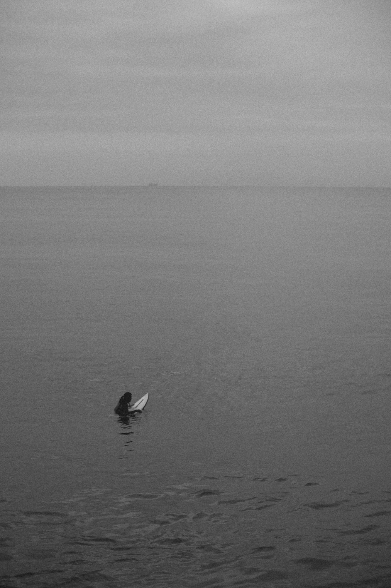 2022-09-18 - Durban -  Person in ocean on surfboard.j