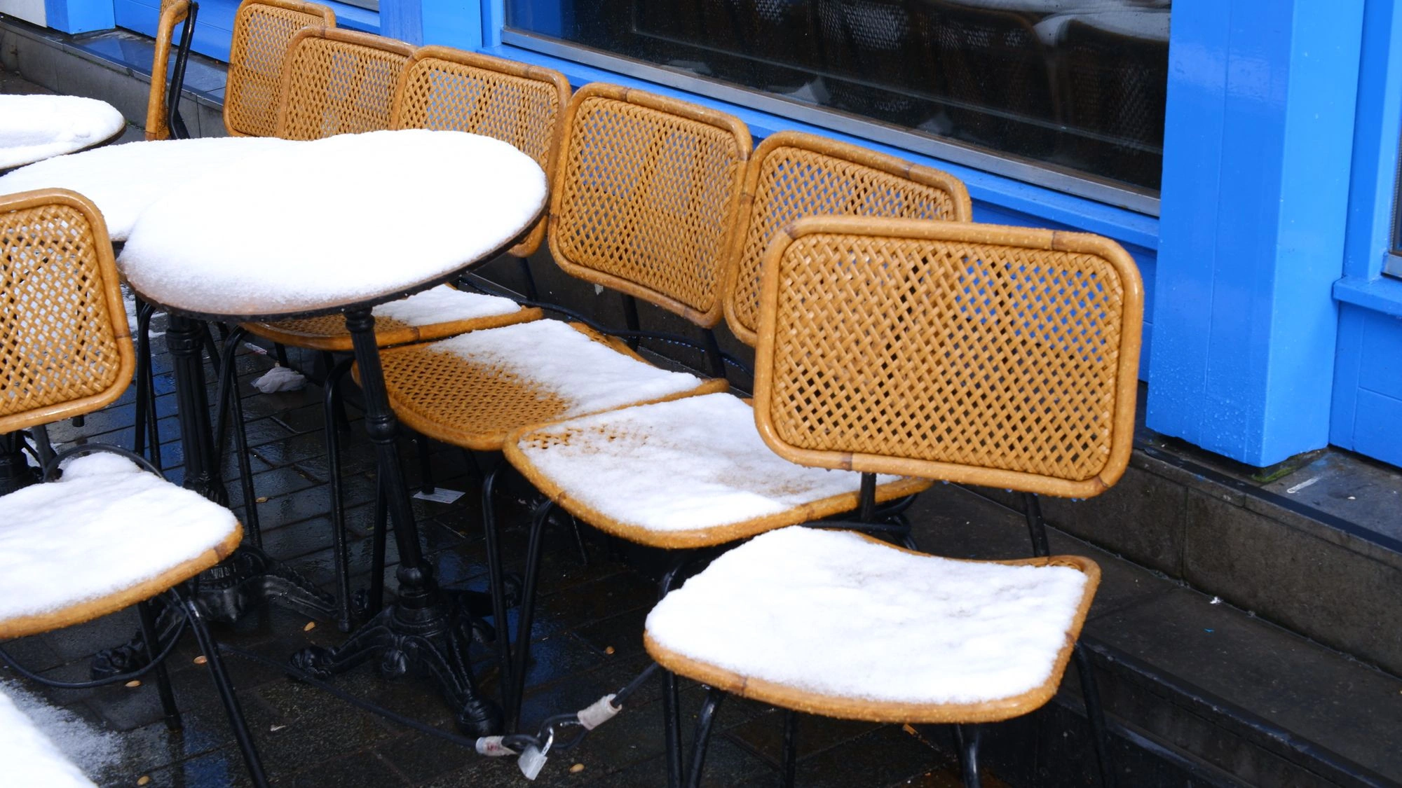 Snow covered patio chairs.J